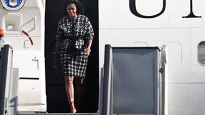 First lady Michelle Obama steps off her plane at Copenhagen's Kastrup Airport Sept. 30. (AP Photo)