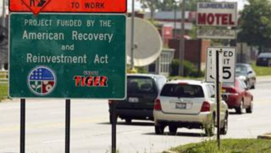 Highway sign declaring, "Project Funded by the American Recovery and Reinvestment Act."