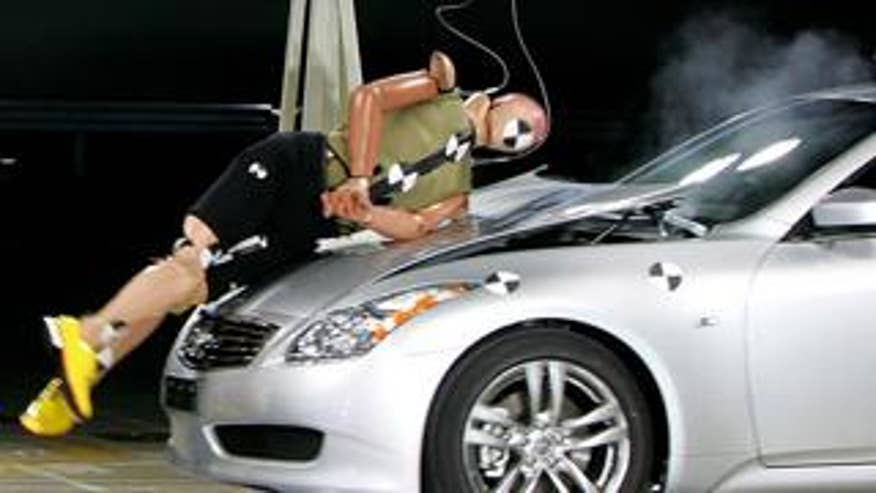 This crash-test dummy might have needed health insurance before getting hit by this Nissan Skyline. (AP Photo)