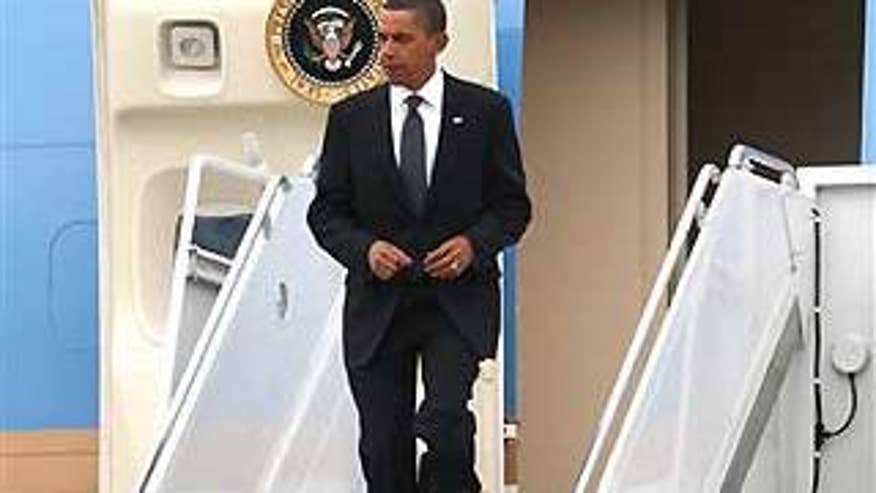 Sept. 9, 2009: President Obama arrives at JFK International Airport in New York on his way to a memorial ceremony for late anchorman Walter Cronkite (AP).