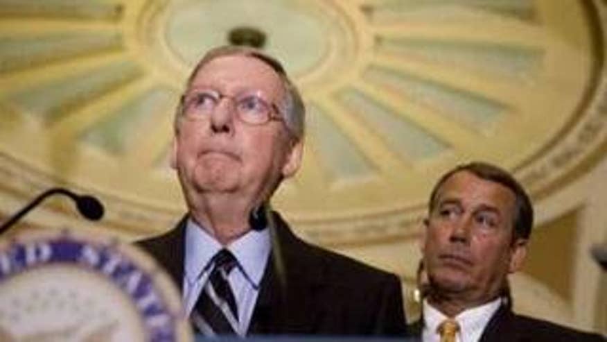 Senate Minority Leader Mitch McConnell and House Minority Leader John Boehner, shown here in a Jan. 5 file photo, are standing by their opposition to a public option. (Reuters Photo)