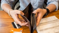 Americans grappling with high inflation are racking up credit card debt