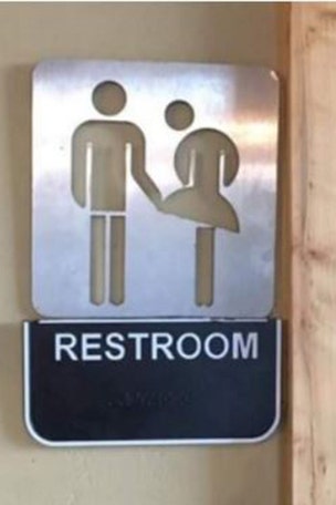 Pizza shop forced to remove bathroom sign