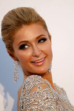 Paris Hilton goes topless