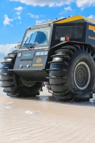 Huge wheeled military ATV swims and surprises