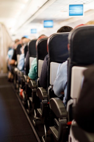 Passenger charged with slapping man, exposing himself