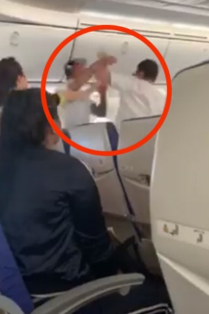 Wild airplane brawl caught on film