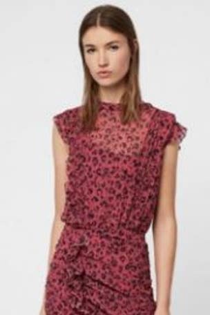 Wedding guest sparks debate over ‘cheap’ mini dress