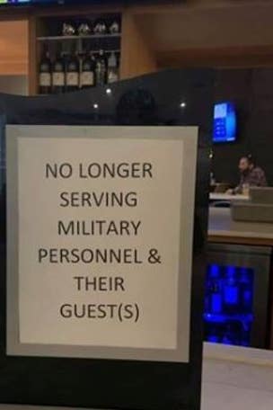 Employees fired for 'offensive' military sign