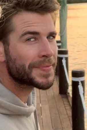 Liam all smiles after Miley split