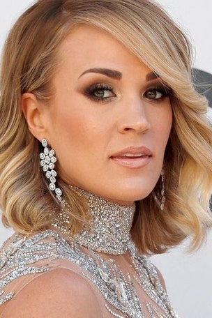 Carrie bares ALL in bikini