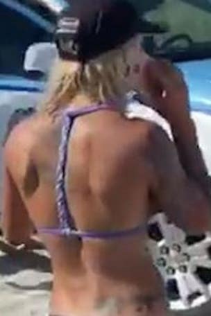 Woman DETAINED over swimsuit