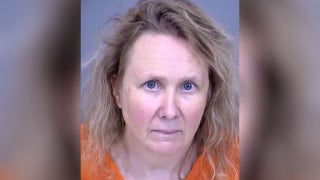 Woman killed husband, dog after saying she heard him, others threatening to 'shoot her and cut off her legs'