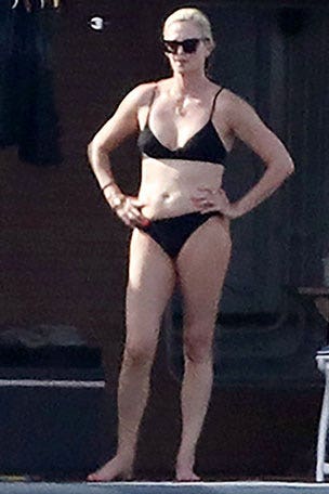 Charlize Theron SOAKS up the sun