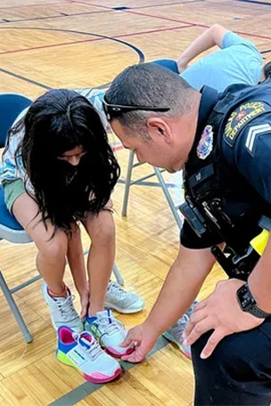 Cops give kids NEW SHOES