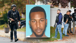 Authorities search for suspect at large who allegedly shot two police officers