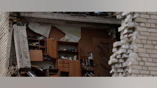 wall of apartment building blown open in ukraine bombing