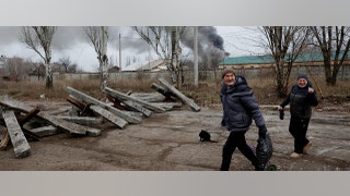 couple walking after bombing