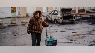 woman water bottles after bombing