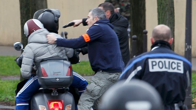 French police in standoff with two suspects in Paris shooting