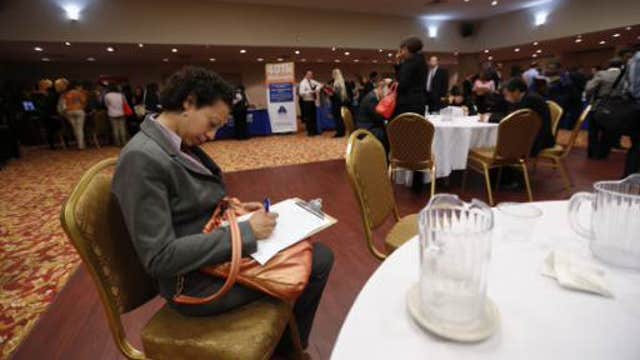 Weekly jobless claims fall to near 15-year low 