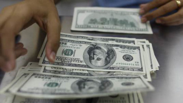 How can investors gain from the strong dollar?