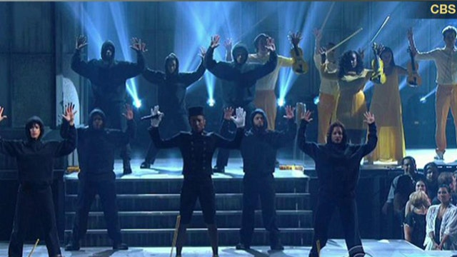 Hands up gesture at the Grammys