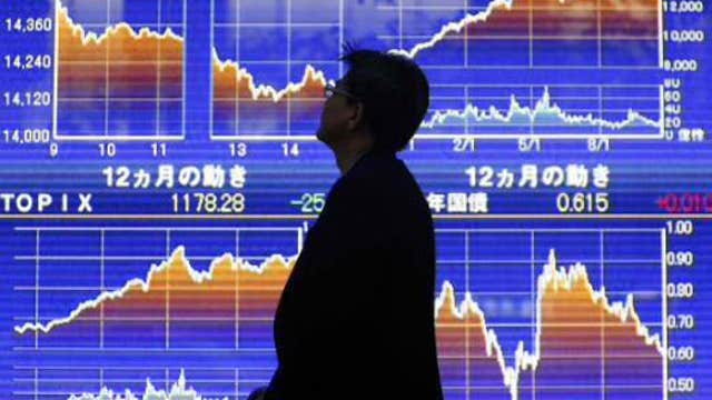 Asian shares mostly lower, Shanghai gains