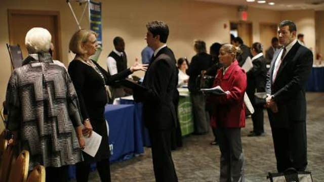 U.S. economy adds 295,000 jobs in February, unemployment rate falls