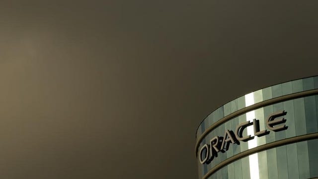 Oracle sales flat, profit down 