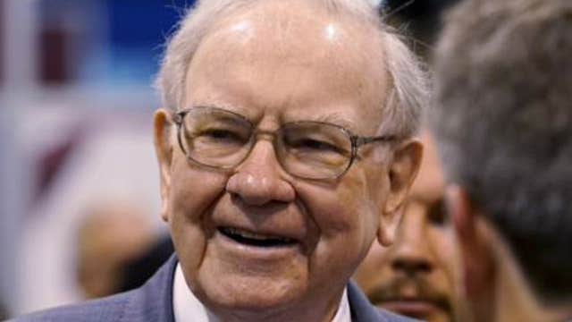 Warren Buffett walks the exhibition floor at Berkshire’s annual meeting