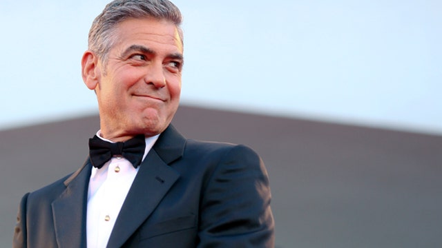 Time Warner shareholder takes on George Clooney
