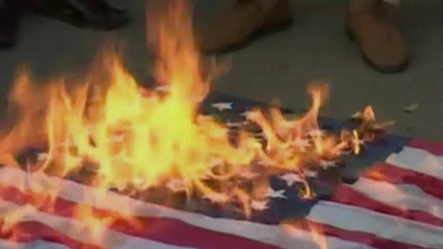 Motorcycle club takes on American flag burning activists