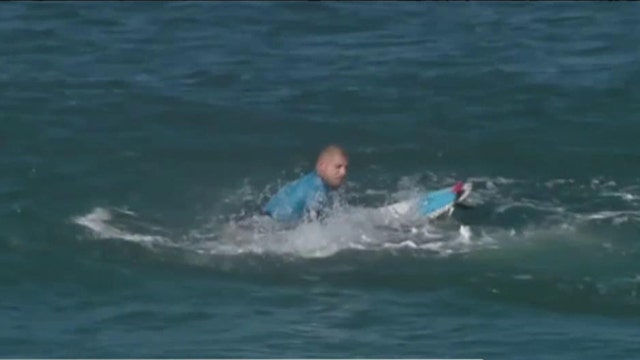 Surfer fights off shark attack during competition