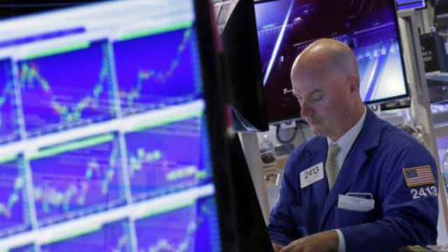Stocks battle to close shortened week on a high note