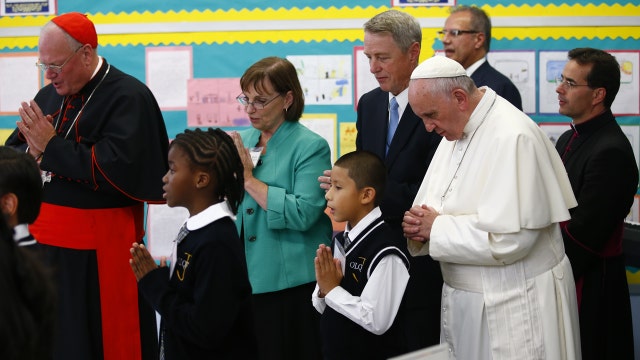 Pope Francis meets with school children, immigrants