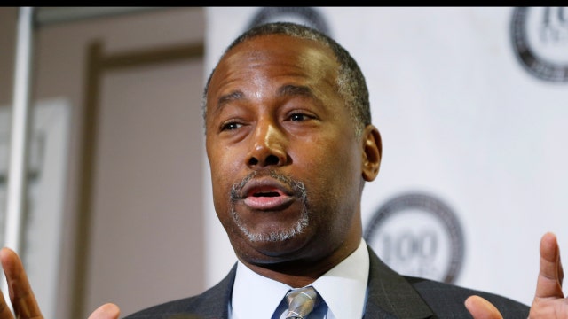 Why is Ben Carson in favor of a flat tax plan?
