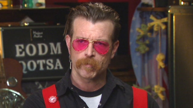 Kennedy discusses security with the Eagles of Death Metal lead singer Jessie Hughes.