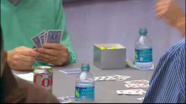 Buffett, Gates compete in a game of bridge