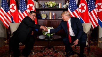 President Trump and North Korea's Kim Jong Un sign a joint document at the nuclear summit.