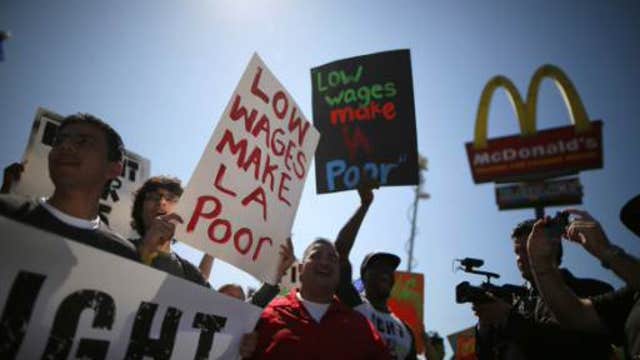 CBO: minimum wage hike will ease poverty, cost 500,000 jobs