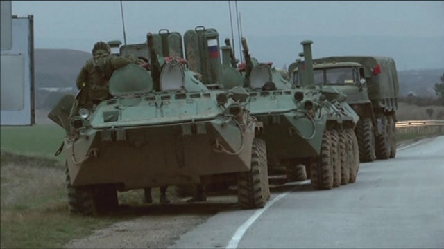 Russian military lands in 2 airports in Ukraine’s Crimea