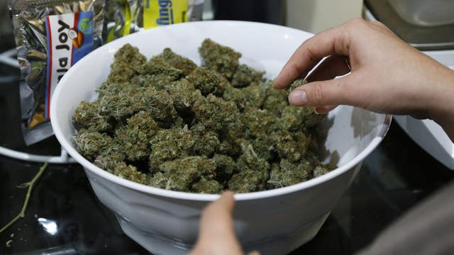 Colorado pot shop owners on huge tax bill
