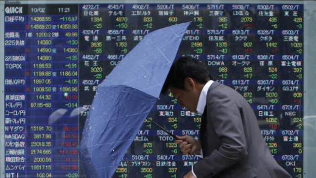Asian markets mostly lower, Japan’s winning streak ends