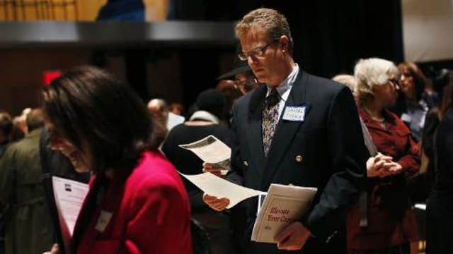 Weekly jobless claims fall to 312,000