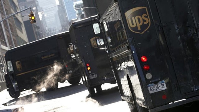 UPS lowers outlook, slashes earnings forecast