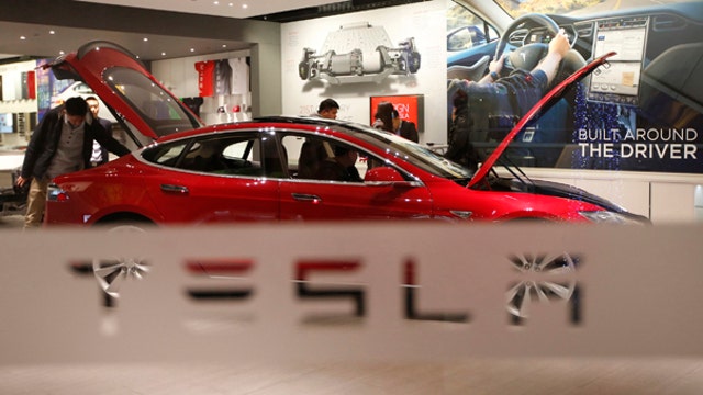 Tesla shares get boost from 2Q earnings