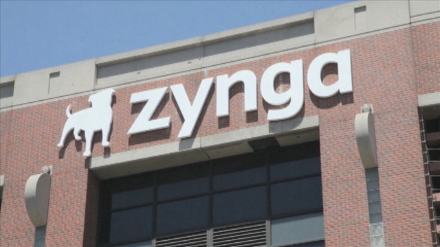 Zynga reports wider loss, lowers outlook