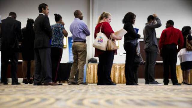 Weekly jobless claims fall to 289,000