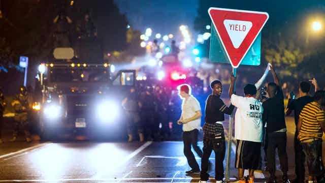 Ferguson police under fire as protests continue